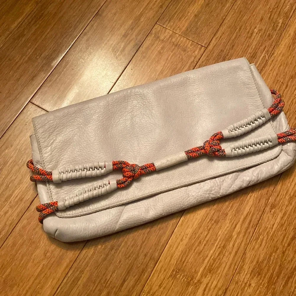 L.A.M.B. By Gwen Stefani gray Leahter clutch -orange rope detail